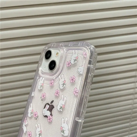 A clear case with white and pink flowers on it