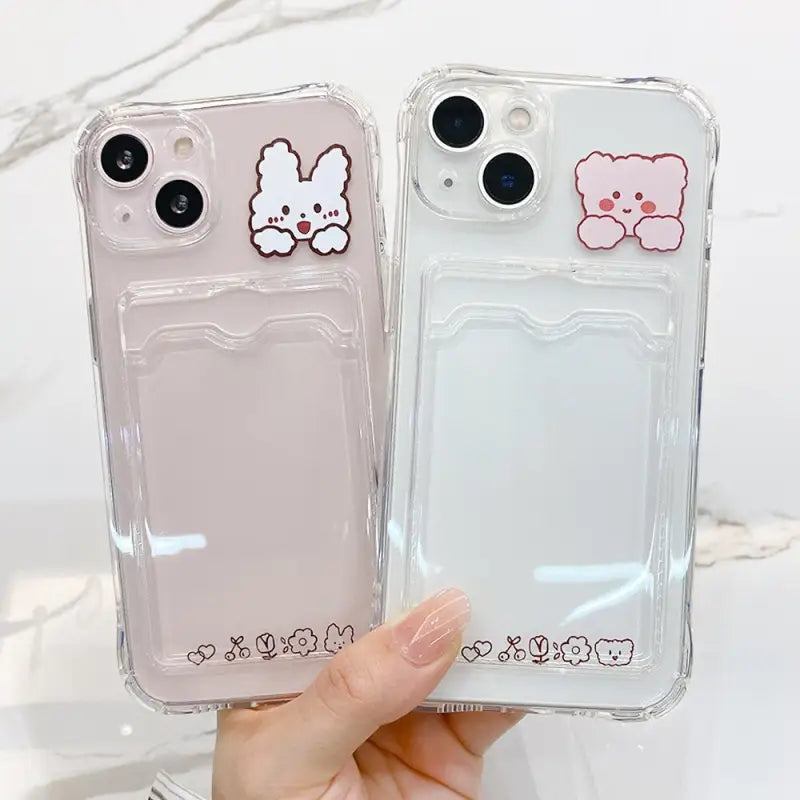 two clear cases with cartoon characters on them