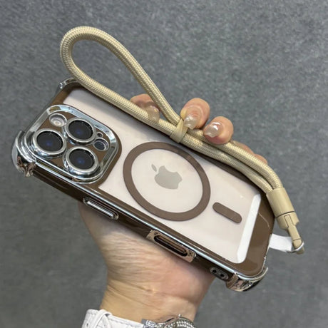 Clear iPhone case with a brown border and MagSafe ring, featuring a beige wrist lanyard.