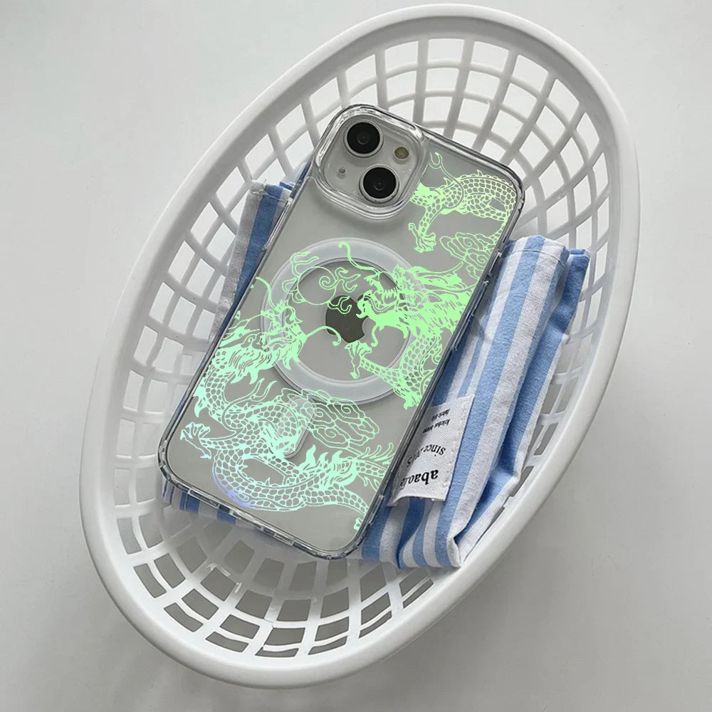 A clear iPhone case with a glowing green dragon design and a MagSafe ring.