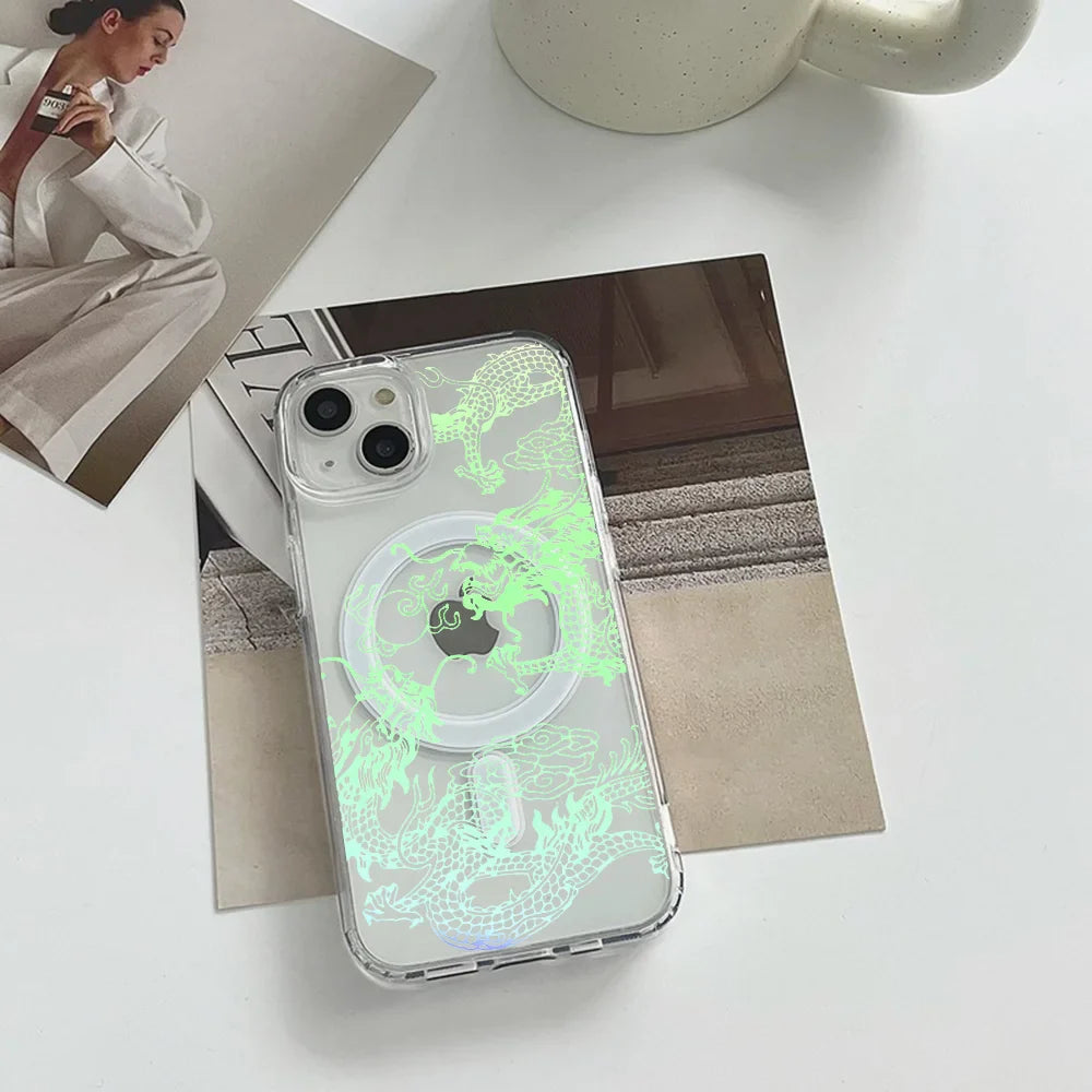 Clear iPhone case with a glowing green dragon design and a circular magnetic attachment.