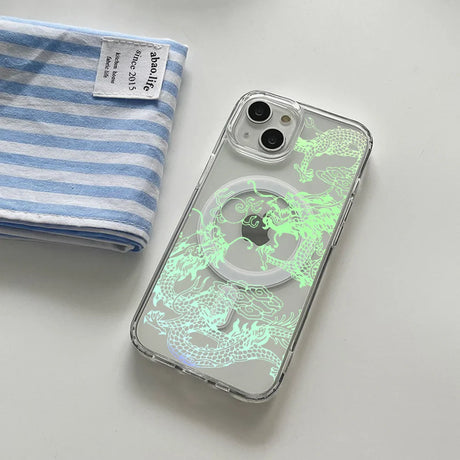 Clear iPhone case with a glowing green dragon design and a MagSafe ring.