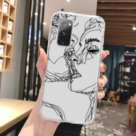 Clear phone case for samsung galaxy with black abstract art design of two faces in profile on light gray back side