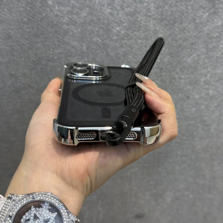 Clear phone case with chrome edges and a black wrist strap.