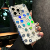 Clear phone case with daisy pattern and MagSafe ring.