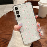 Clear phone case with delicate pink and white floral pattern showing back side for samsung galaxy models