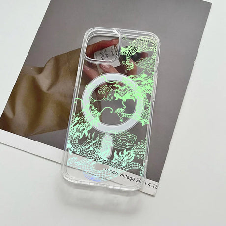 Clear phone case with a glowing green dragon design and a MagSafe ring.