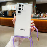 A clear phone case with a purple lanyard.