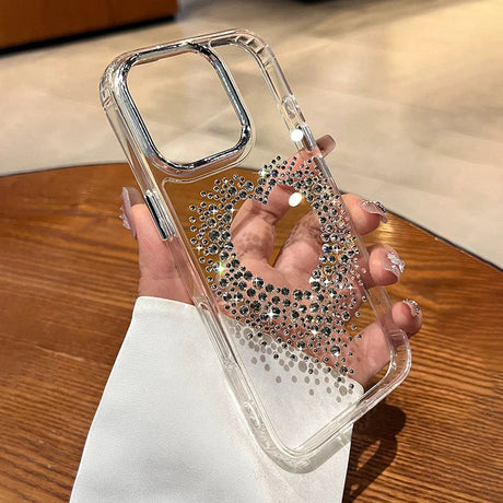 Clear phone case with rhinestone heart.