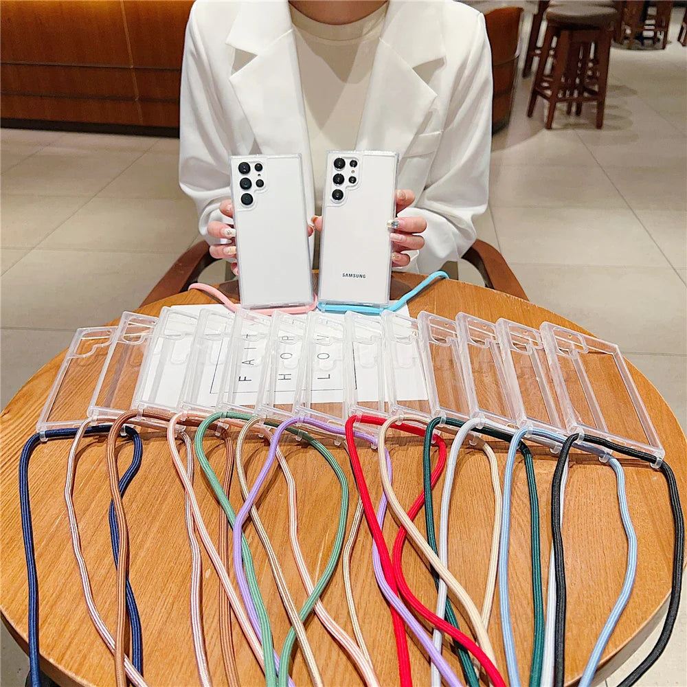 Clear phone cases with colorful lanyards.