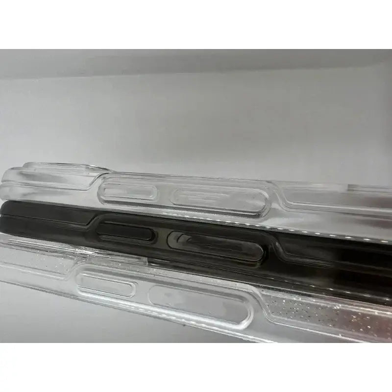 a clear plastic case with a black handle