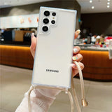 Clear smartphone case with a beige lanyard.