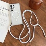 A clear smartphone case with an integrated white circular magnet and an attached white lanyard.
