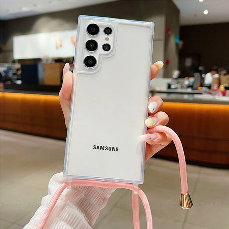 Clear smartphone case with a pink lanyard.