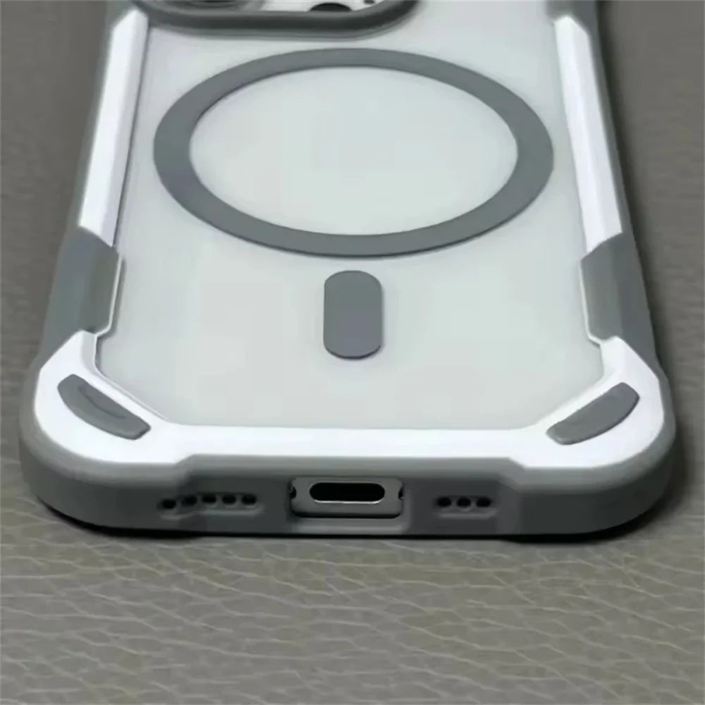 Clear smartphone case with reinforced gray and white corners, a circular MagSafe ring, and a bottom port opening.