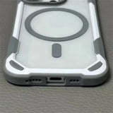 Clear smartphone case with reinforced gray and white corners, a circular MagSafe ring, and a bottom port opening.