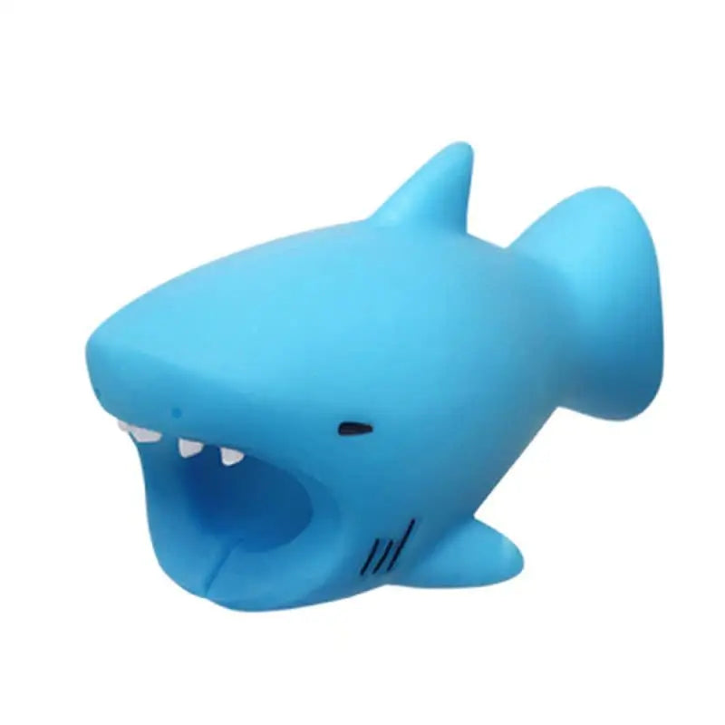 a blue plastic toy shark with a big mouth