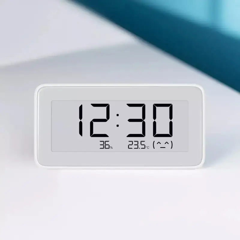 A clock on a white surface