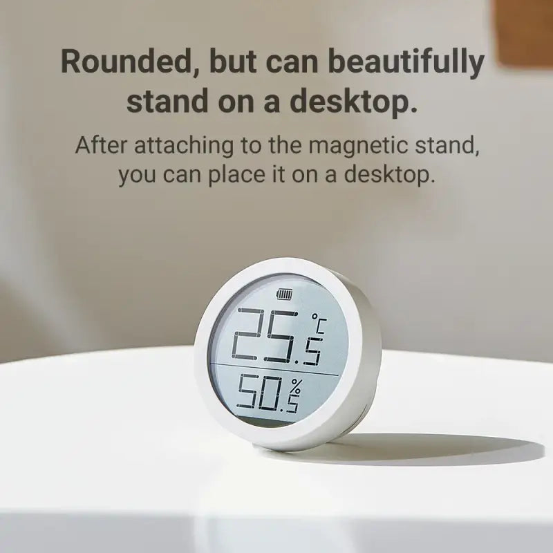 A clock sitting on top of a white table