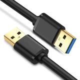 a close up of a black and gold colored usb cable