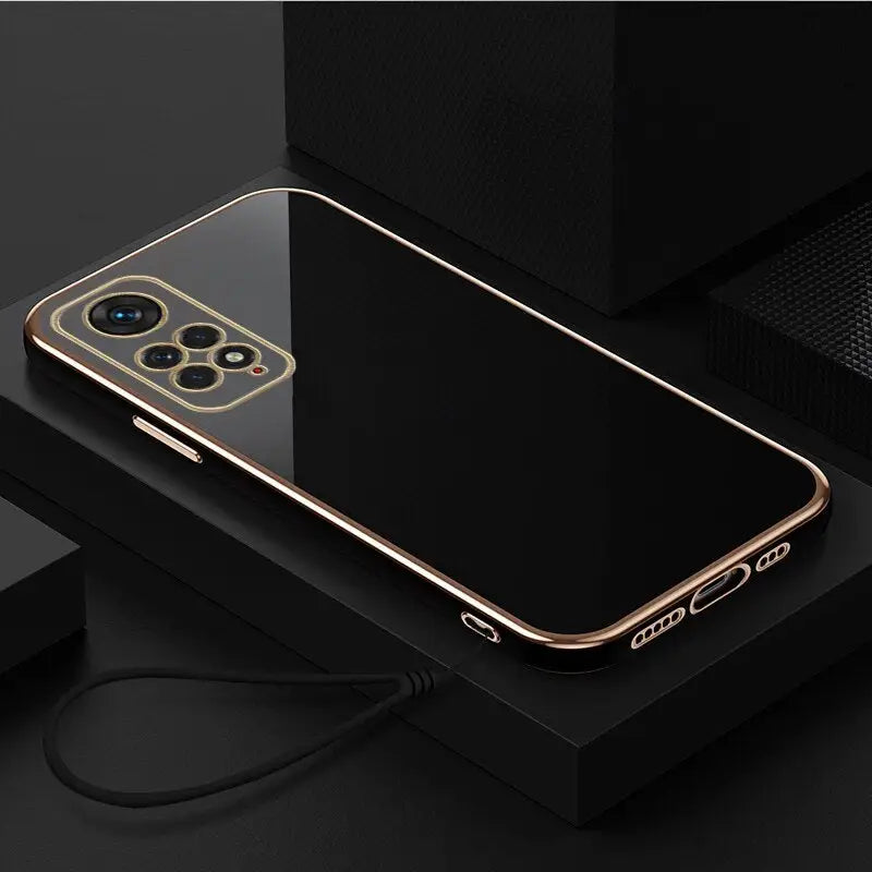 a gold iphone case with a charging cable