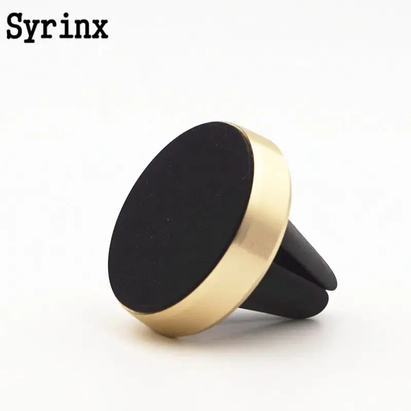 a black and gold ring with a black surface