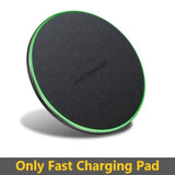 a close up of a black and green wireless charger on a white background