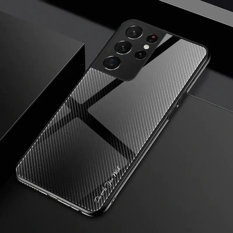 a close up of a black phone with a black box