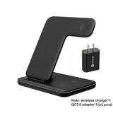 a close up of a black phone charging dock with a charger