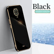 the back of a black phone with a gold frame