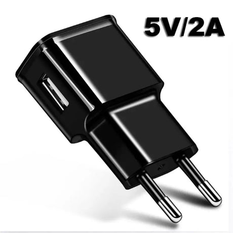 a close up of a black power adapter with a white background