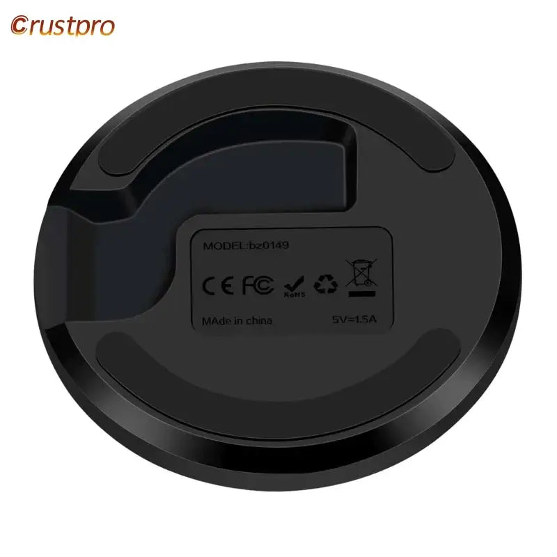 A close up of a black robot vacuum cleaner on a white background