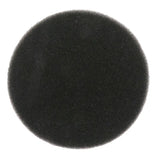 a close up of a black round object on a white surface