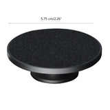 a black round knob with a black surface