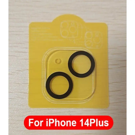 a close up of two black rubber o - rings on a yellow package