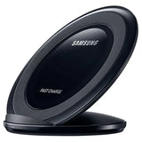 A close up of a black samsung wireless charger on a white surface