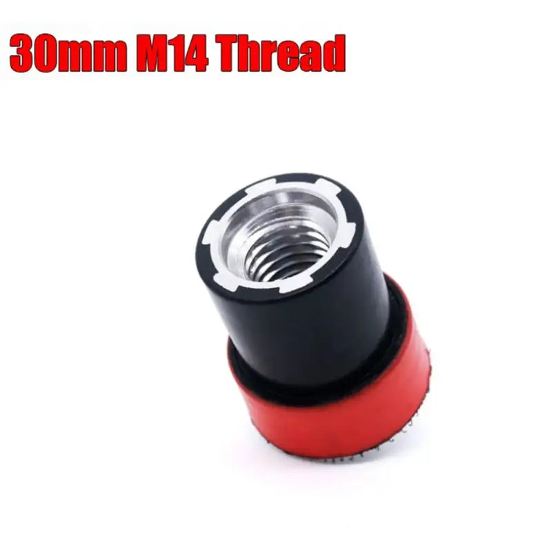 a close up of a red and black thread thread plug