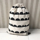 a black and white bag with black and white clouds