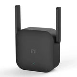 A close up of a black wifi amplifier with a white background