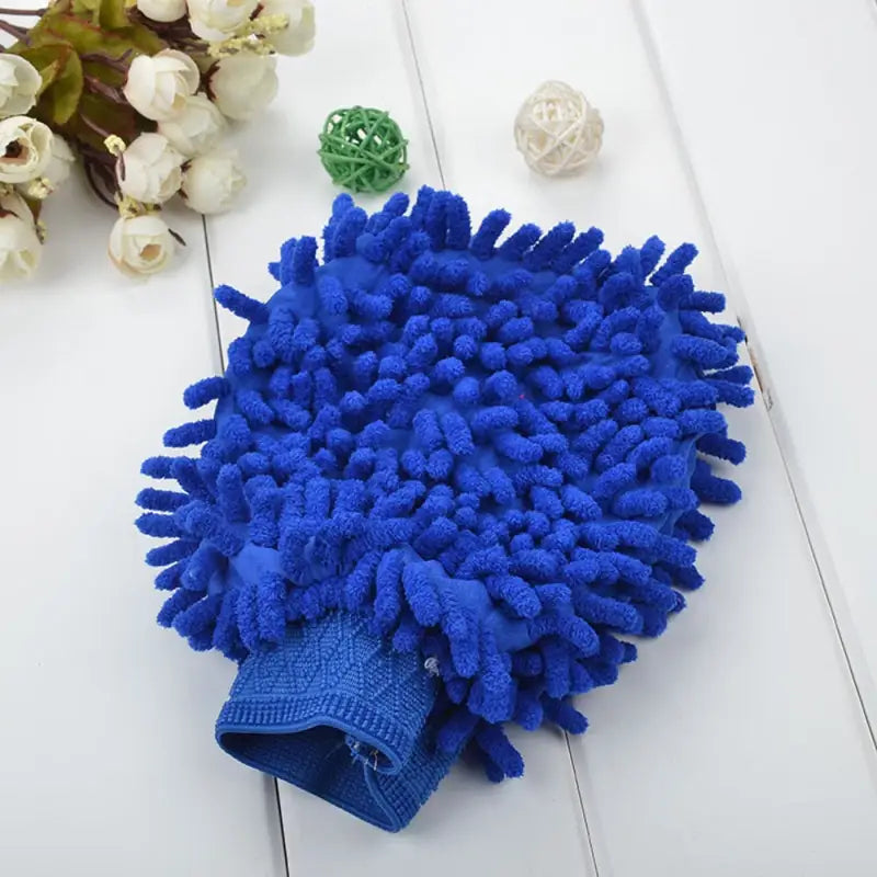 a blue pom with a white flower on it