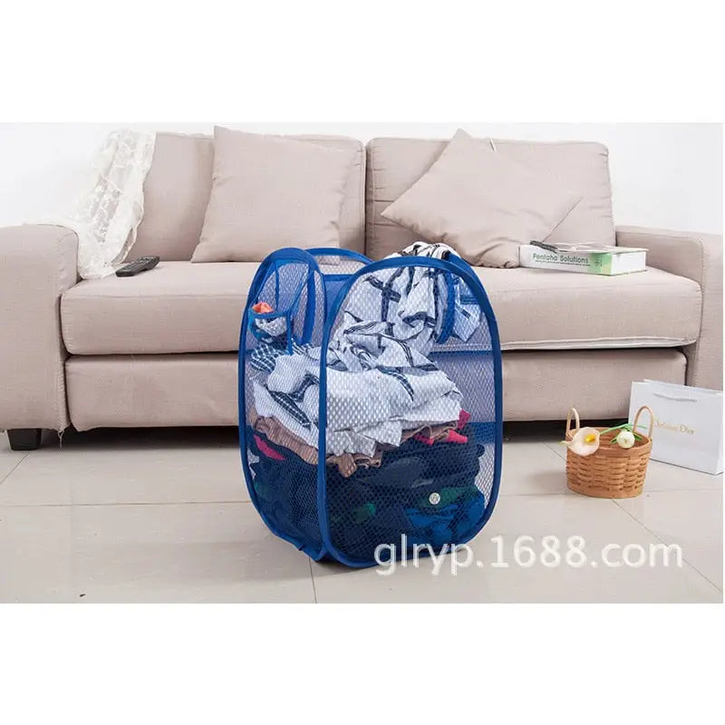 a blue mesh laundry bag with clothes inside