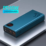 a close up of a blue power bank sitting on top of a laptop