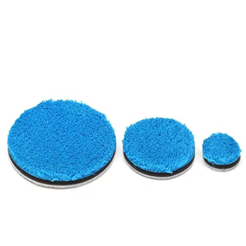 a close up of a blue sponge pad and two blue sponge pads