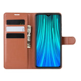 a close up of a brown leather wallet case with a credit card holder