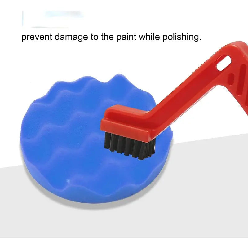 a blue brush with a red handle and a white background