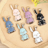 a close up of a plate with a bunch of different colored bunny charms