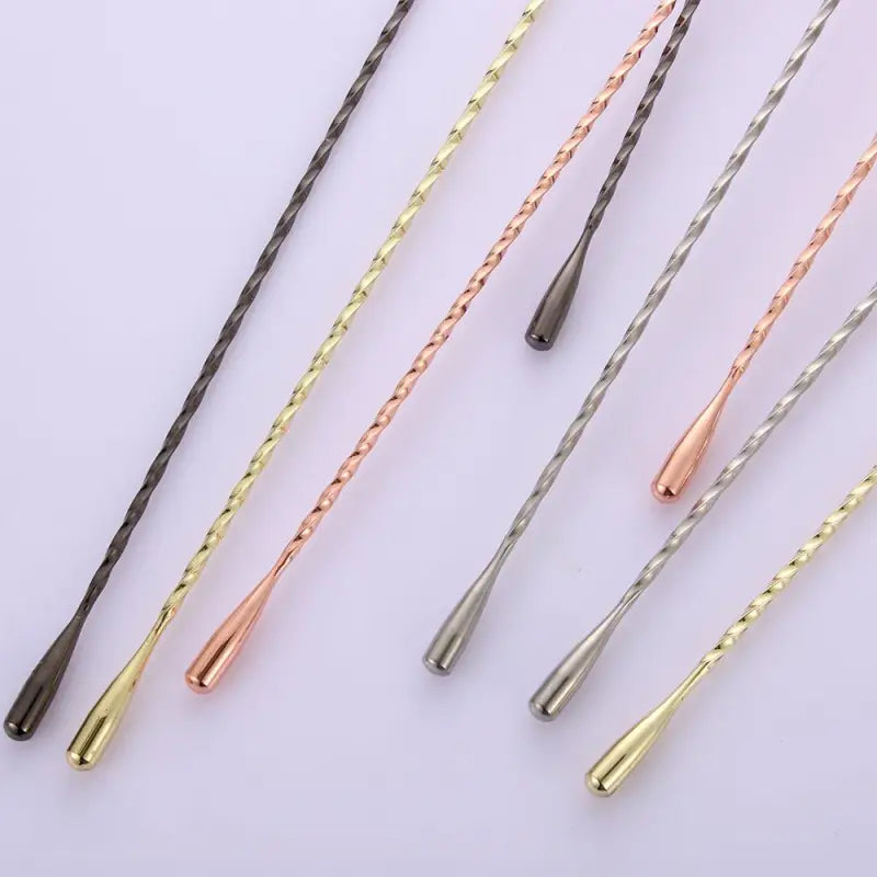 several different colored hair pins are arranged in a row
