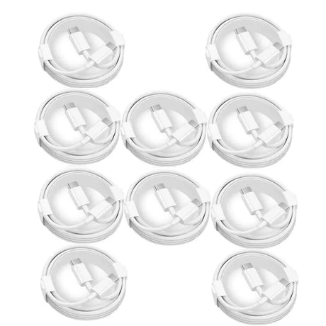 a close up of a bunch of white plastic lids on a white surface