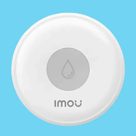 A close up of a button with a water drop on it
