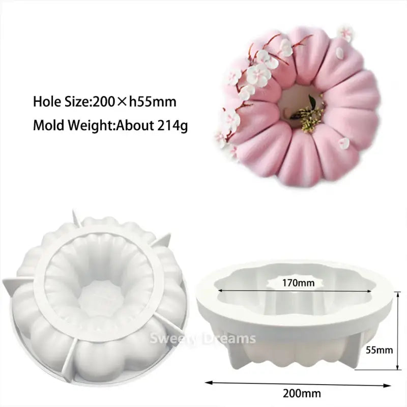 a close up of a cake mold with a flower on it